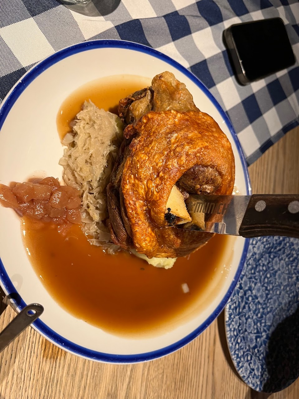 Crispy pork knuckle with mash and sauce at Munich Brauhaus The Rocks