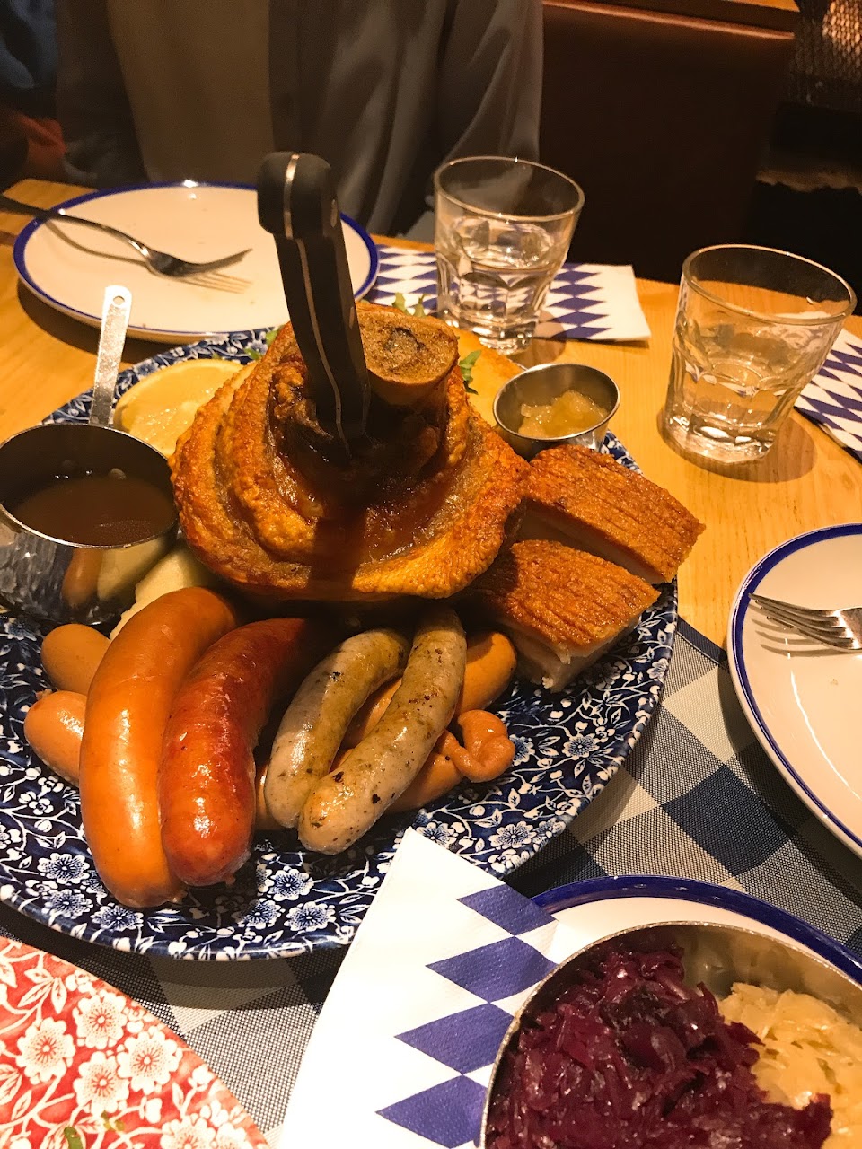 Sausage and pork platter with cabbage and sides